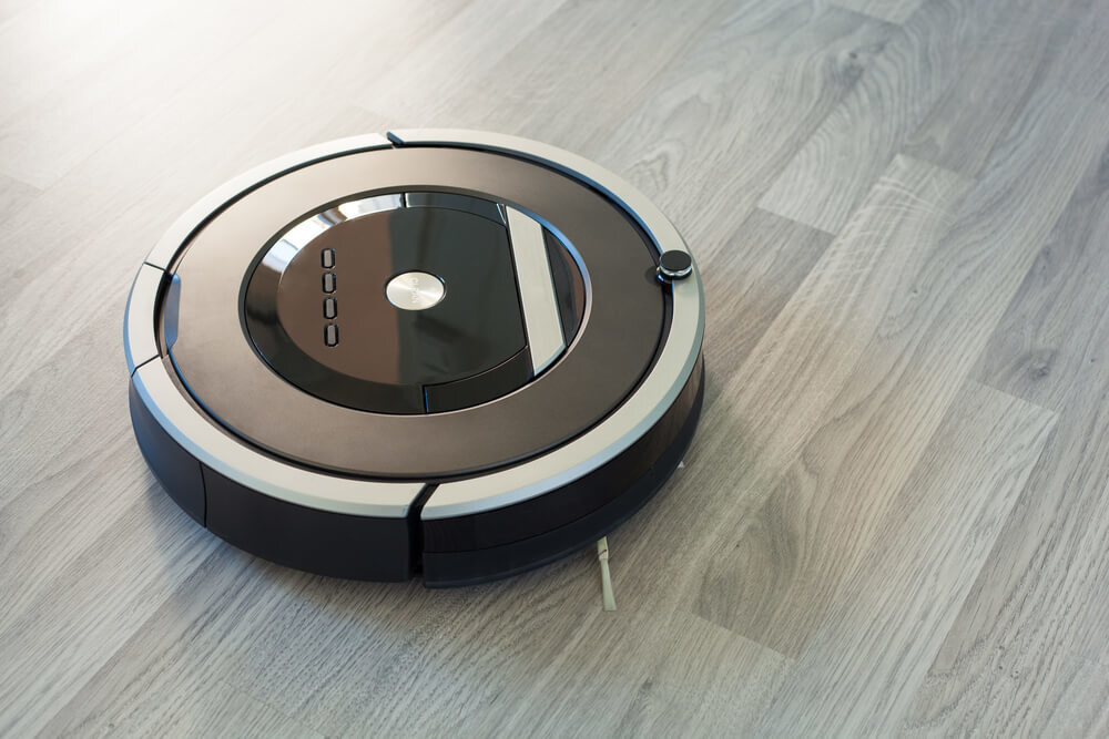 床を掃除するロボット掃除機
